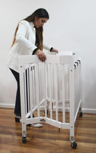 Load image into Gallery viewer, Baby Inc Stowaway – Folding Wooden Cot